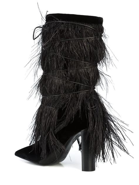 saint laurent yeti feather boots.